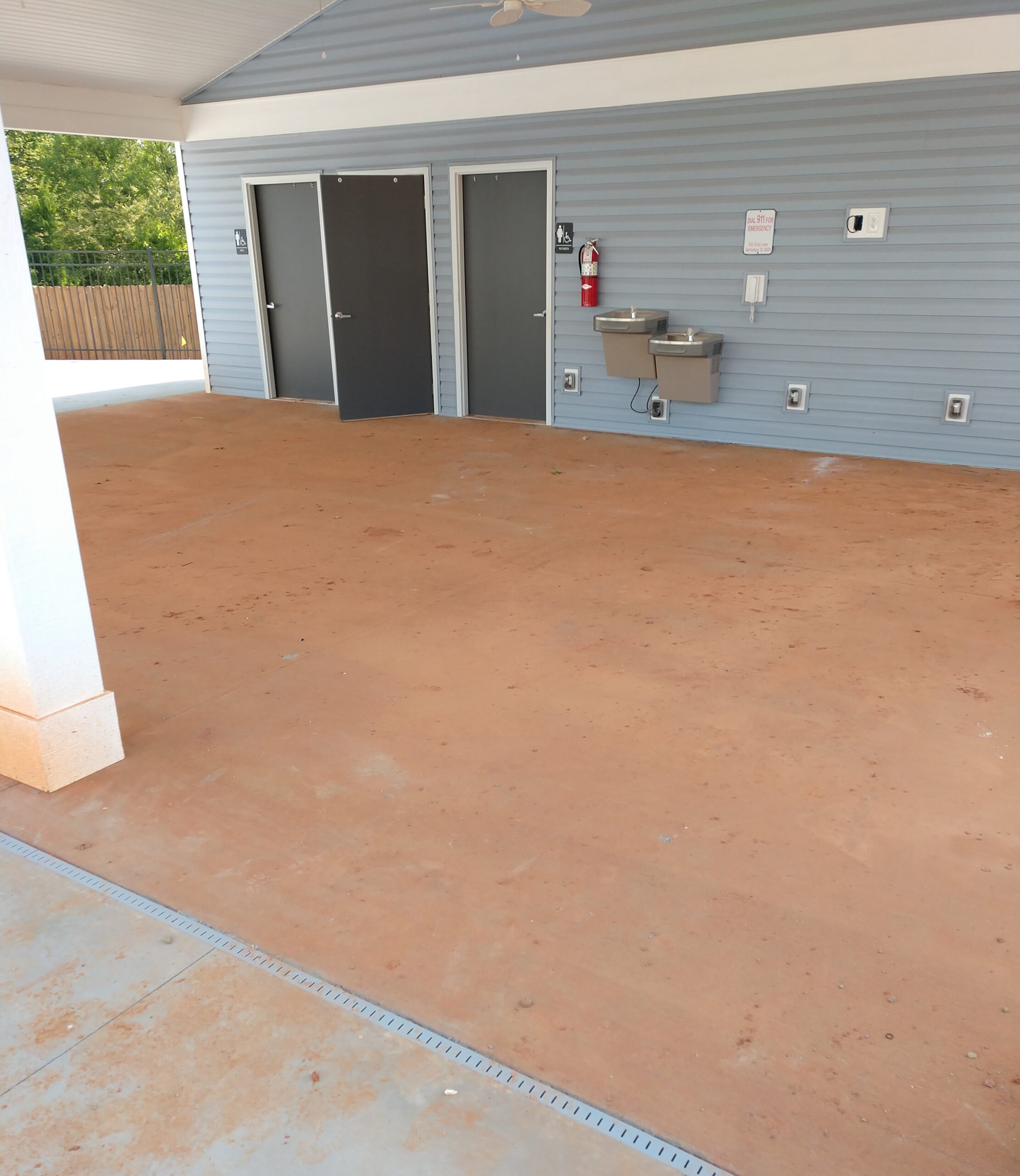 Pool-deck-red-clay-before-pressure-washing
